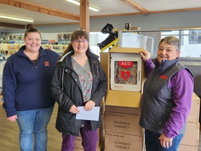 Lisa and Kayla donating 14 AED devices to S Coast Head Start