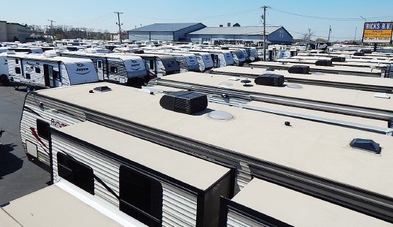 RVs parked in secure storage at Rick's RV Center