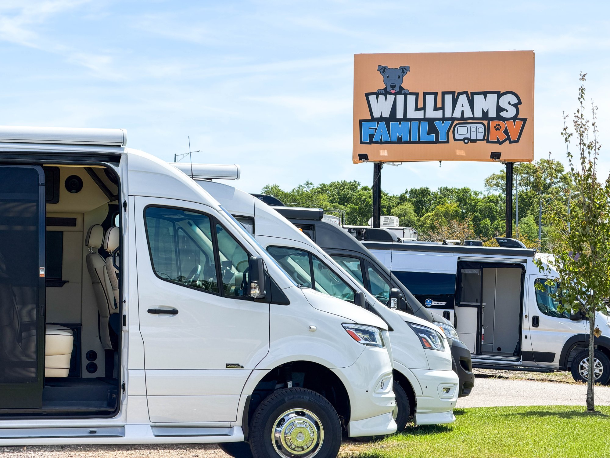 Friendly RV sales specialist helping a couple