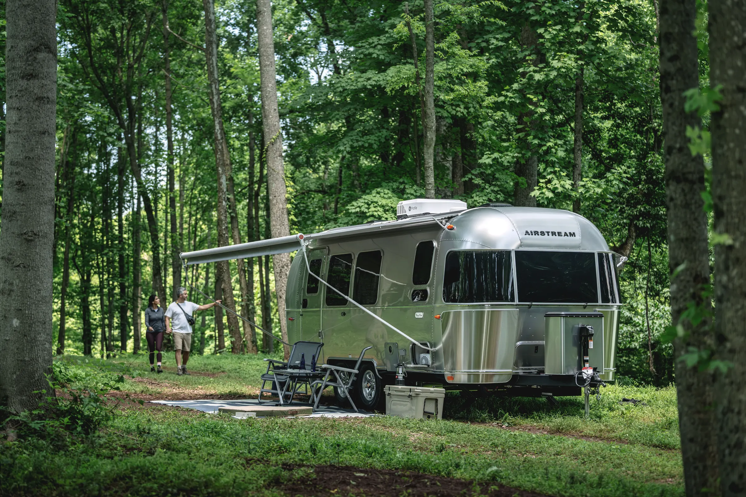 Airstream Flying Cloud at a forest campsite