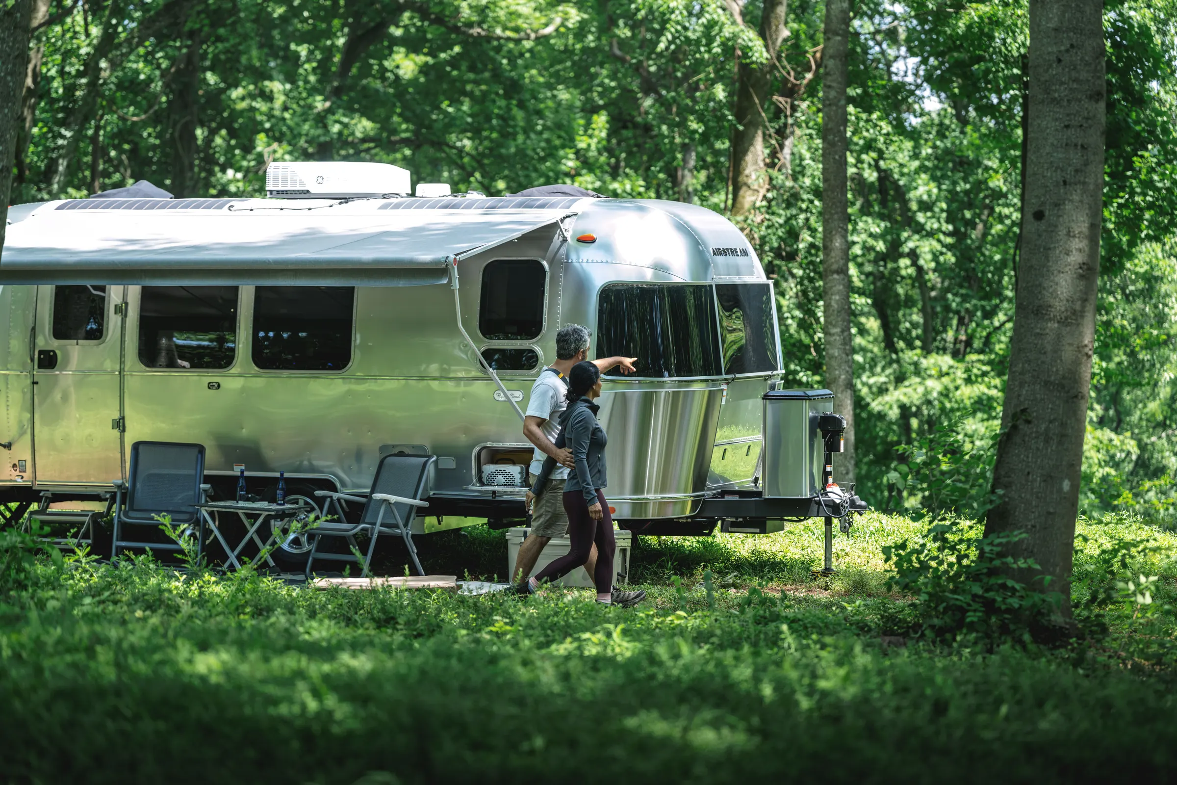 Airstream Flying Cloud parked in the woods