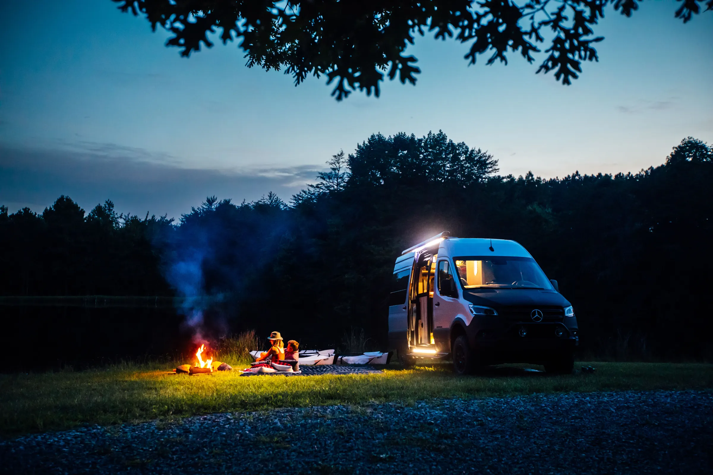 Airstream Interstate at a campsite at dusk